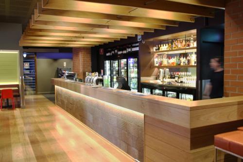 a bar in a restaurant with a long counter at Imperial Motel in Bowral