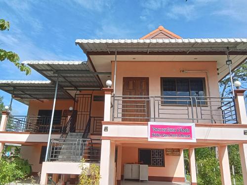 a house with a pink sign in front of it at Hidden Gem in Ban Na No