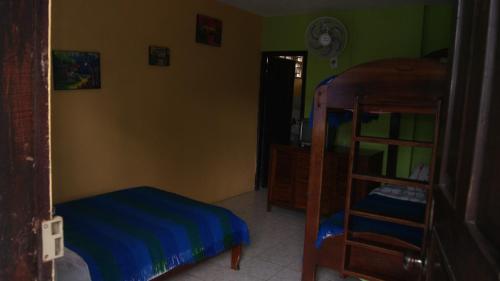 a bedroom with a bed and a bunk bed at Zumag Sisa in Tena