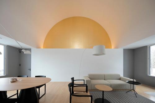 a living room with a couch and a table at Wakkanupuri Resorts in Teshikaga