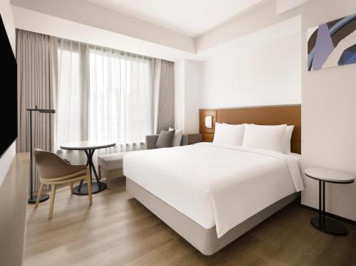 Letto o letti in una camera di AC Hotel by Marriott Seoul Gangnam