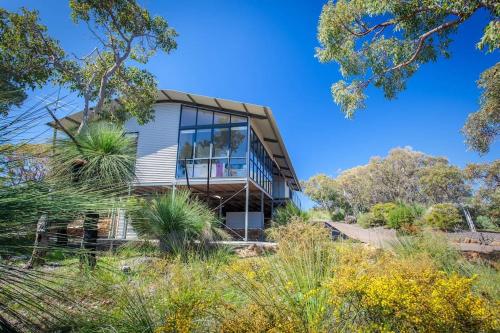 a house on a hill with plants and trees at Matilda I Private Properties in Dunsborough