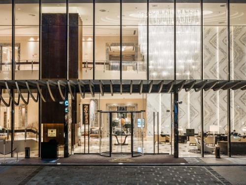 an empty lobby with a large glass building at The St. Regis Chengdu in Chengdu