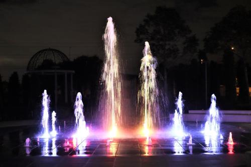 a group of water fountains at night at KSL ESPLANADE HOTEL with HOT SPRING in Klang