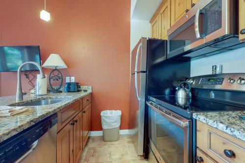 a kitchen with a sink and a refrigerator at Year Round Getaway 301 in Breckenridge