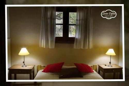 a bedroom with two lamps and a bed and a window at Concordia, Argentina in Concordia