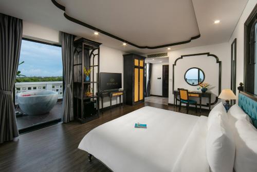 Postel nebo postele na pokoji v ubytování Bliss Hoi An Beach Resort & Wellness