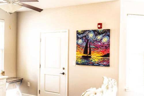 a room with a painting on the wall at A Superb 3Bedrooms in Zionsville Suitable for Long Stay in Zionsville