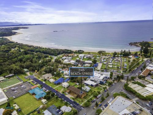 an overhead view of a suburb with a beach street sign at Beach Street Bliss in Woolgoolga