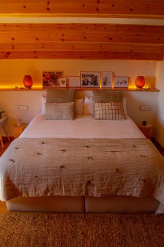 a bedroom with a large bed in a room at Santa Llúcia Rupit in Rupit