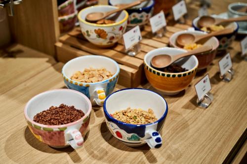 a group of bowls of food on a table at Aloft Osaka Dojima in Osaka
