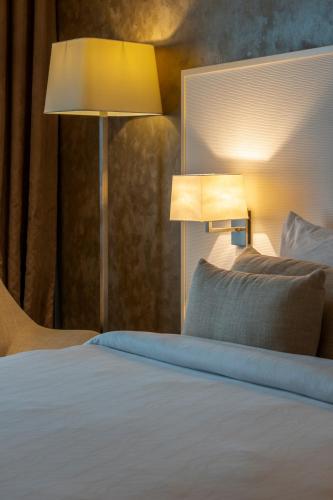 Postel nebo postele na pokoji v ubytování Remal Hotel
