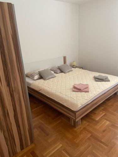 a bedroom with a bed with two pillows on it at Aurora in Pag