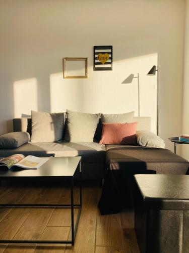 a living room with a couch and a table at Peter`s Lucky Home Balaton, Vonyarcvashegy in Vonyarcvashegy