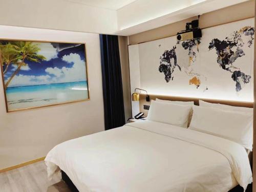 Postel nebo postele na pokoji v ubytování Kyriad Marvelous Hotel Weihai Happy Gate Weigao Plaza