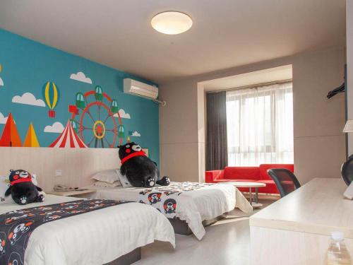 a bedroom with two beds with dogs sitting on them at Jinjiang Inn Zhenjiang Suzhou University Suning Plaza in Zhenjiang