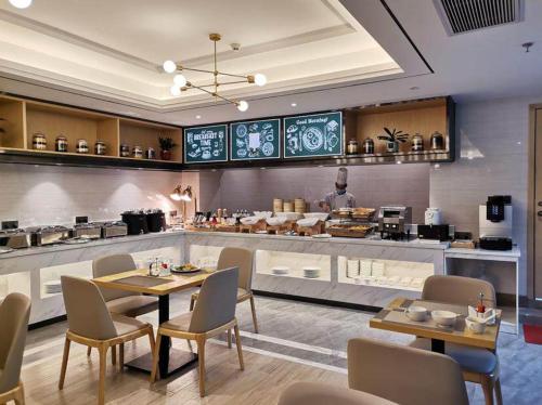 Restoranas ar kita vieta pavalgyti apgyvendinimo įstaigoje Kyriad Marvelous Hotel Zhongshan West District