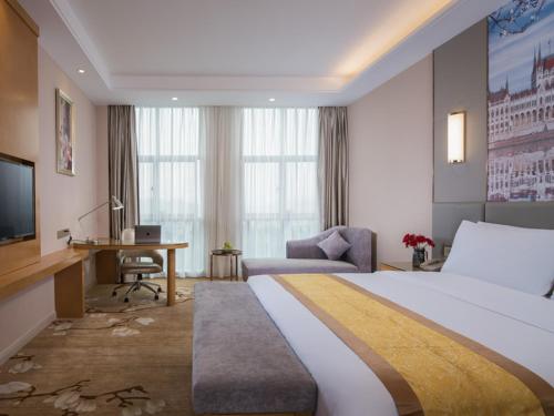 Ένα ή περισσότερα κρεβάτια σε δωμάτιο στο Vienna International Hotel Zhejiang Wuyi Hushan