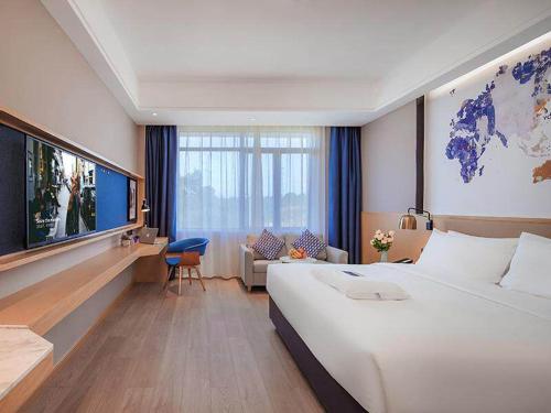 Katil atau katil-katil dalam bilik di Kyriad Marvelous Hotel Jingxian