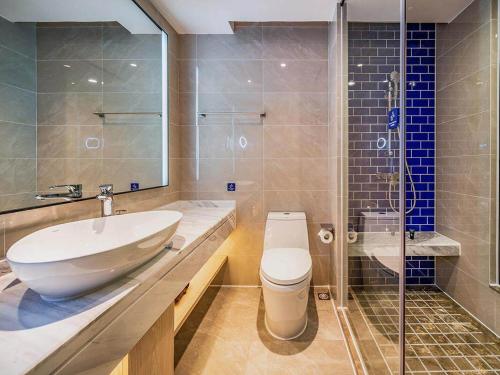 Koupelna v ubytování Kyriad Marvelous Hotel Heyuan Hakka Culture Park