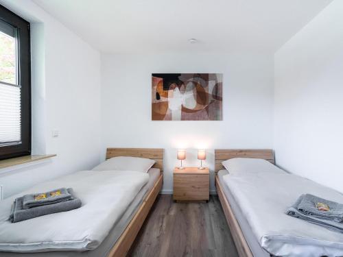 מיטה או מיטות בחדר ב-Haus Laura