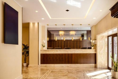 a lobby of a hospital with a waiting room at UNA Hotels Galles Milano in Milan