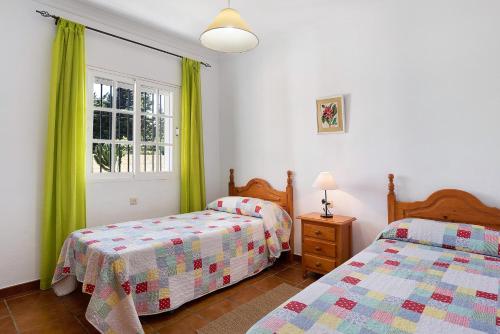 Postel nebo postele na pokoji v ubytování Villa Roche