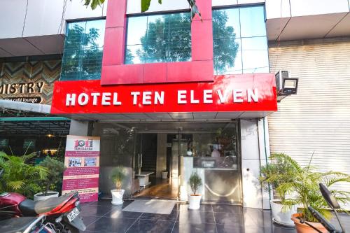 a hotel ten eleven sign in front of a building at FabHotel Ten Eleven in Indore