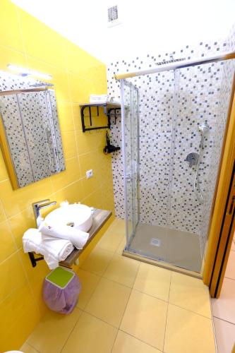 a bathroom with a shower and a sink at Donna Elena B&B in Naples