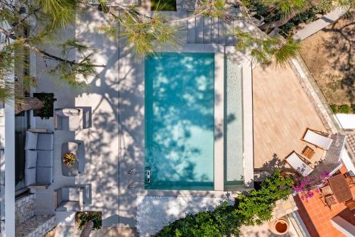 an overhead view of a swimming pool in a house at Aegean View Estate - Villa in Faliraki