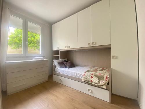 En eller flere senge i et værelse på Casa Olivastro Millenario A