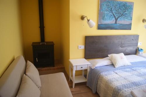 En eller flere senge i et værelse på L'Antojana del Cuera Llanes Aptos