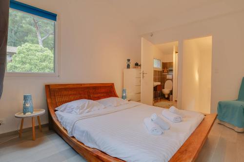 Voodi või voodid majutusasutuse "La Petite Maisonnette" au Calme, Proche Plage toas