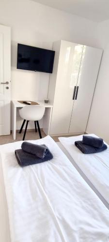 Postel nebo postele na pokoji v ubytování Dinary Apartman