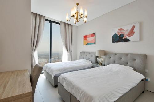 Postel nebo postele na pokoji v ubytování 2 BR High Floor Apartment in Address JBR, Dubai Marina View