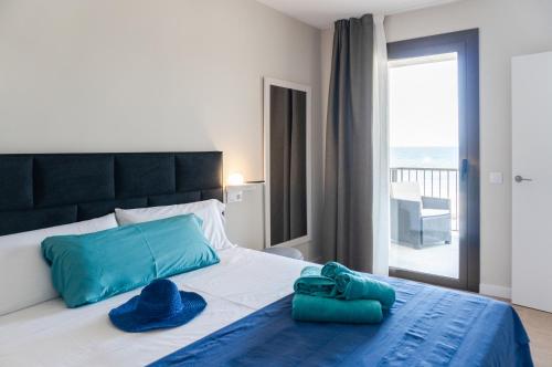 Posteľ alebo postele v izbe v ubytovaní Apartamento en primera linea de mar en La Escala