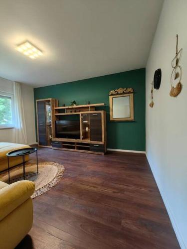 a living room with a couch and a television at New 1 bedroom near Center and beach in Split
