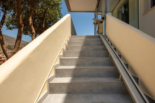 a staircase leading up to a building with trees at Balos Beach in Kissamos