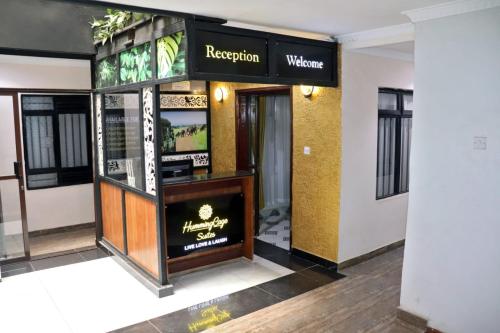 a lobby of a hotel with a reception counter at Humming Cage Suites studios in Nairobi