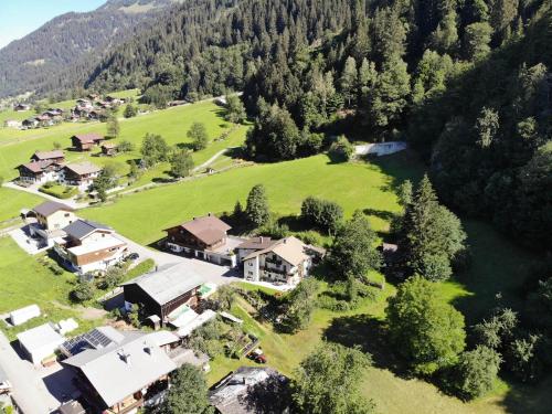 an aerial view of a house in the mountains at Haus Deule in Sankt Gallenkirch
