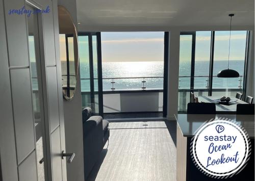 a view of the ocean from a balcony on a ship at Ocean Lookout- 3 Bed Sea View Apt Parking No Fees in Kent