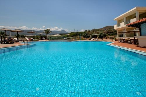 a large blue swimming pool in a hotel at Balos Beach in Kissamos