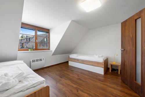 Postel nebo postele na pokoji v ubytování Apartmány v Říčkách - Apartmány V Klidu a V Pohodě
