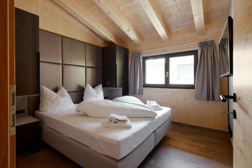 Alm-Lodges Montafon by Pferd auf Wolkeにあるベッド