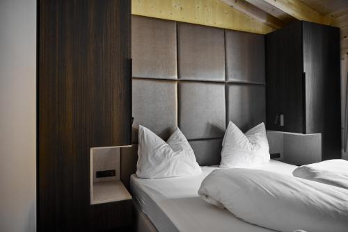 Alm-Lodges Montafon by Pferd auf Wolkeにあるベッド