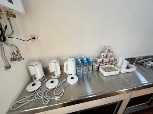 a kitchen counter with various appliances on it at 觀心農舍 民宿 Ageless Farmhouse in Sanyi