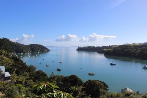 a view of a large river with boats in it at Mangonui Motel in Mangonui