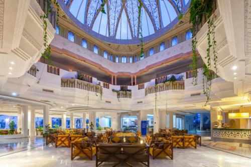 a view of the lobby of a hotel with a large ceiling at Djerba Holiday Beach in Midoun