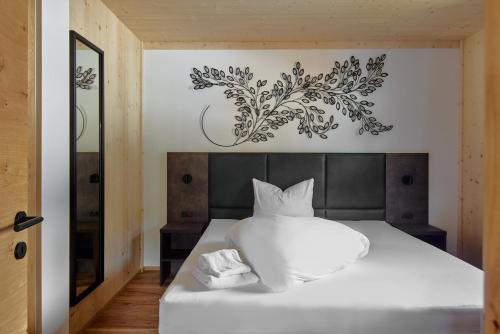 Alm-Lodges Montafon by Pferd auf Wolkeにあるベッド