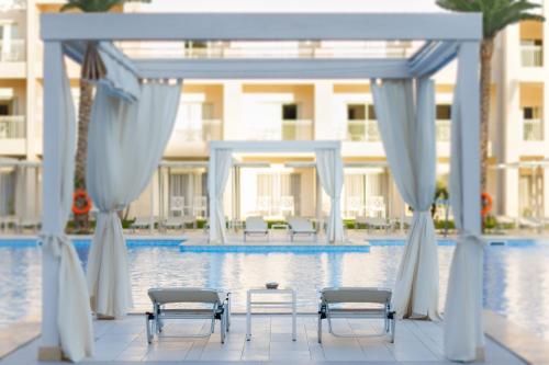 a wedding ceremony at the swimming pool at a resort at JAZ Aquaviva in Hurghada